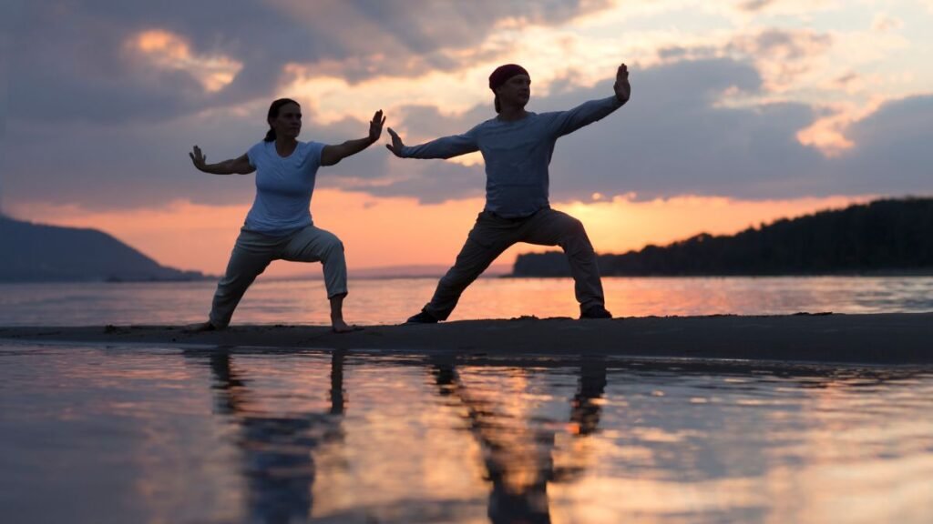 Yoga vs. Tai Chi: Which Mind-Body Practice Is Right for You? 1 tai chi and yoga on the beach
